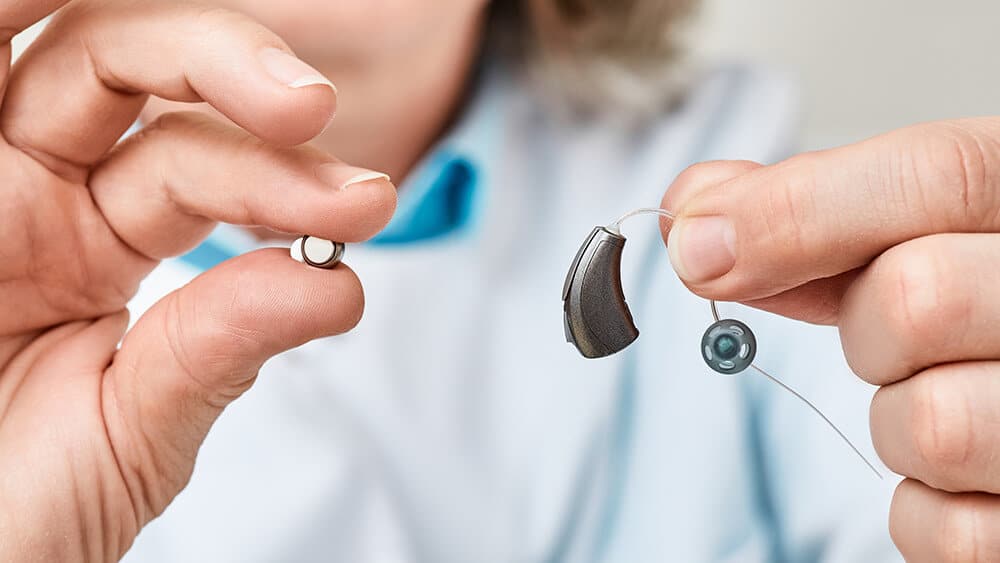 Hearing aid and hearing aid battery