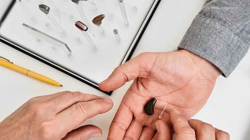 Hearing aid in hand