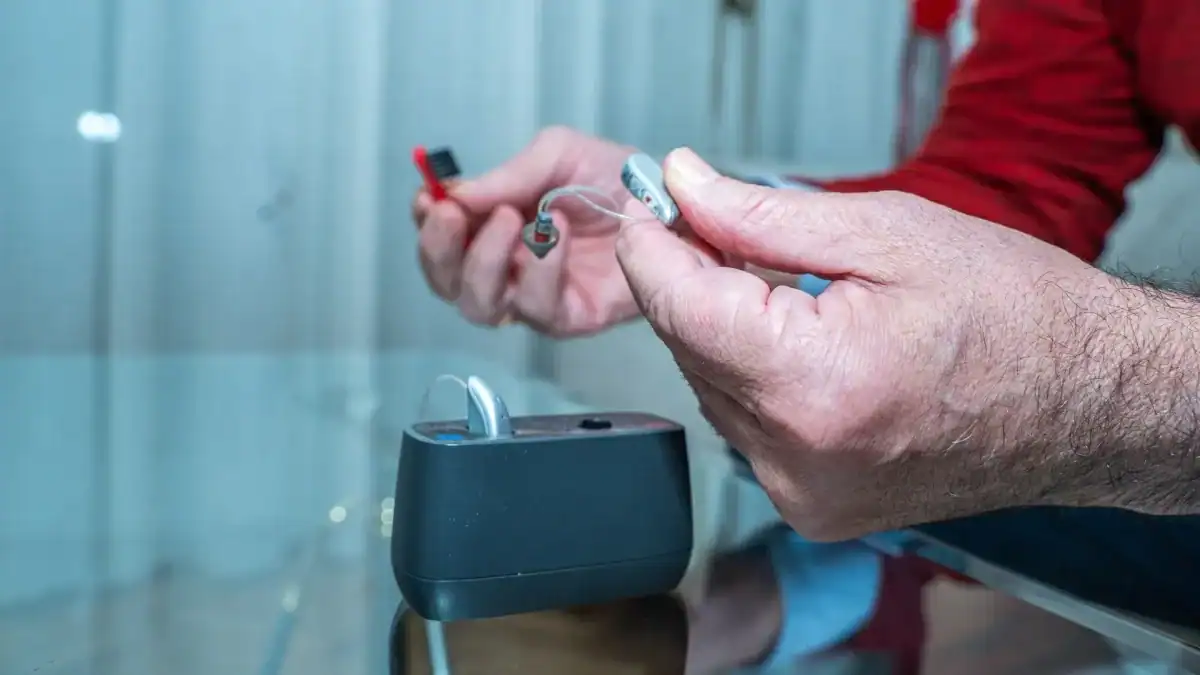 Learn the urgent warning signs that indicate a hearing device requires immediate cleaning to restore clear sound.